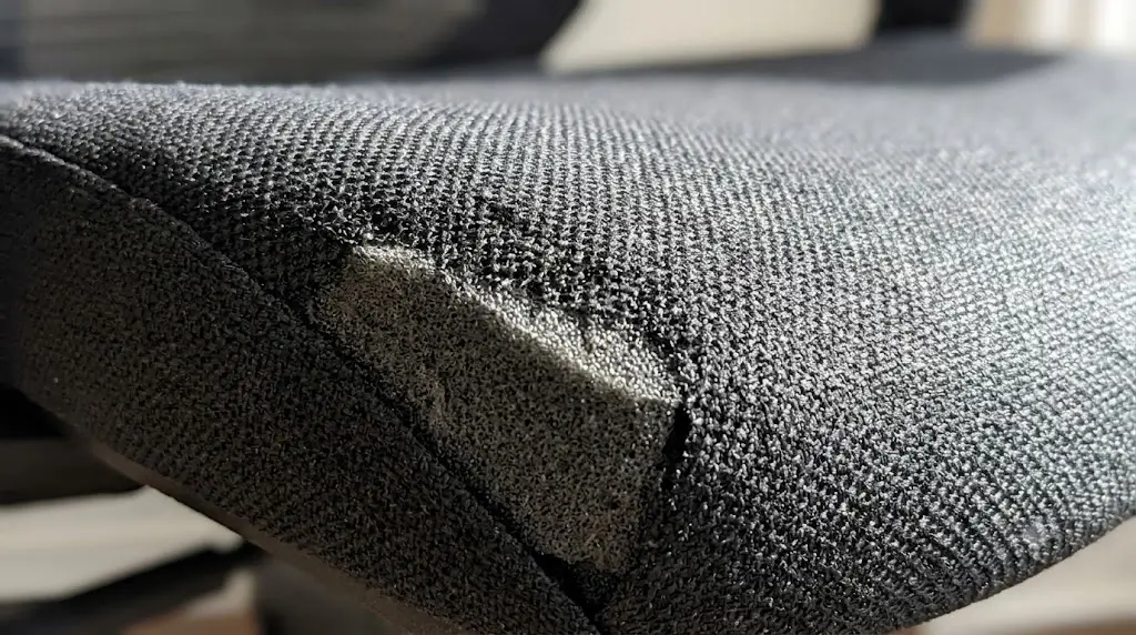 Close-up of ProtoArc EC200 dense molded foam seat cushion and textured fabric